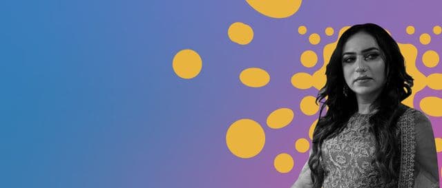 Person in embroidered clothes against a colourful graphic background.