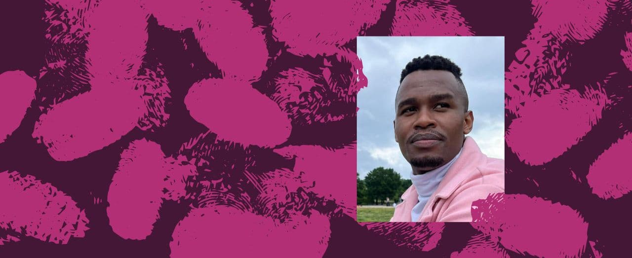 A person outdoors wears a light pink jacket.