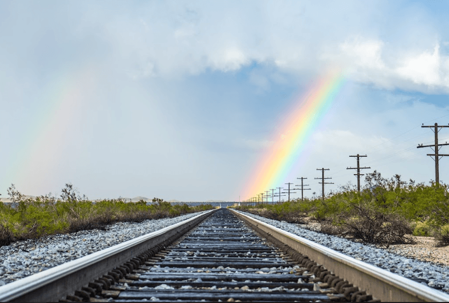 Railroad with rainbow